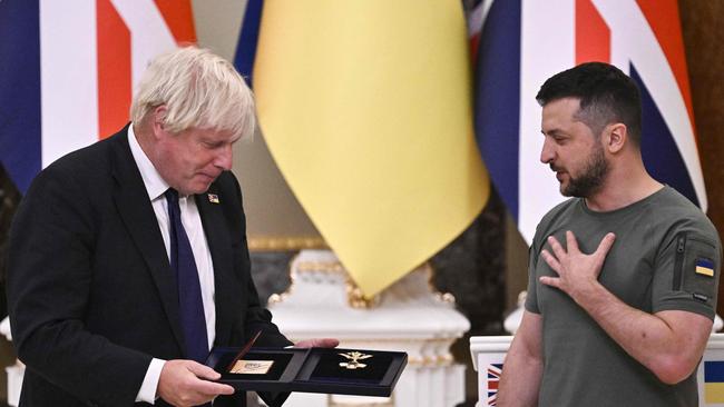 Volodymyr Zelensky awards The Order of Liberty to Boris Johnson in Kyiv last August. Picture: AFP