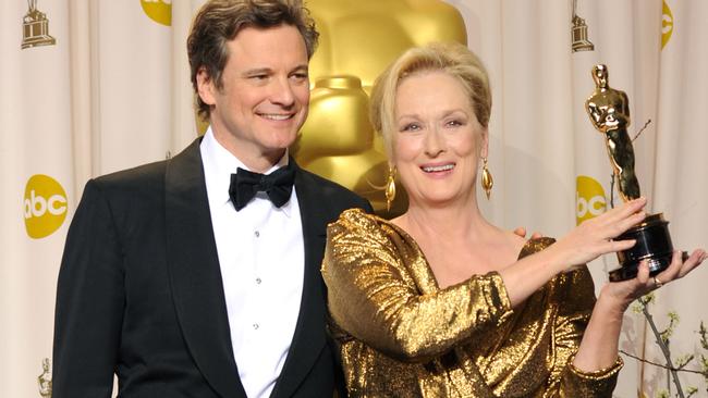 Colin Firth and Meryl Streep pose with their Oscars in 2012.