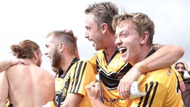 Jubilant Tea Tree Gully players celebrate last season’s shock FFA Cup SA win over West Adelaide. Picture: Adam Butler