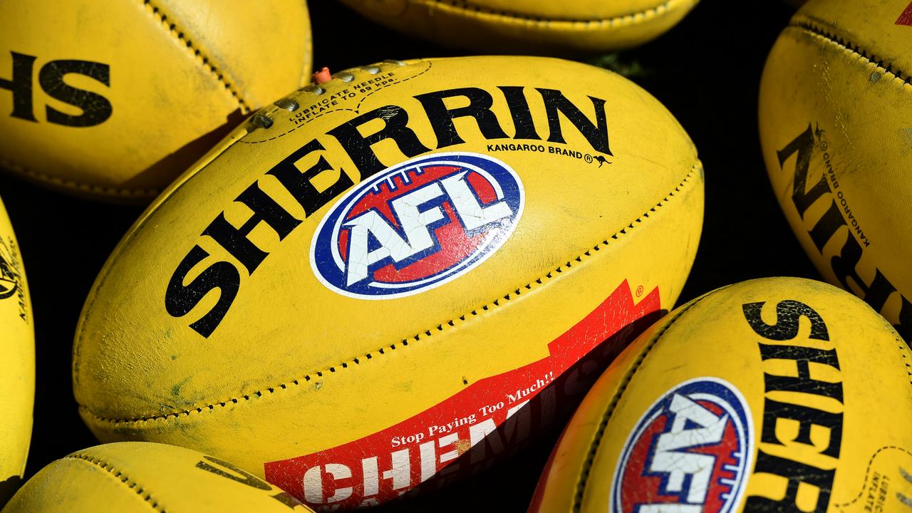 Australian Rules footballs are seen at Arden Street in Melbourne, Thursday, Sept. 10, 2015. (AAP Image/Julian Smith) NO ARCHIVING