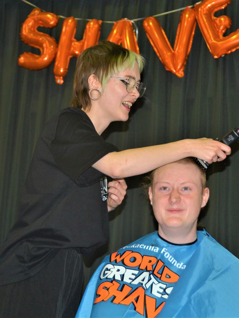 At the St Joseph's College 2023 World's Greatest Shave event is Angus Deacon getting his hair cut by Caitlin Symes from the Hair Room on Russell. Picture: Rhylea Millar