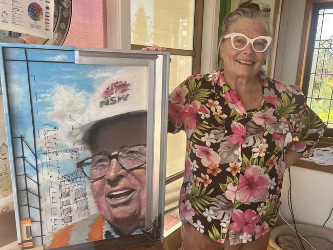 Artist Amanda Doctor with her painting of NSW Building Commissioner David Chandler. Picture: Supplied