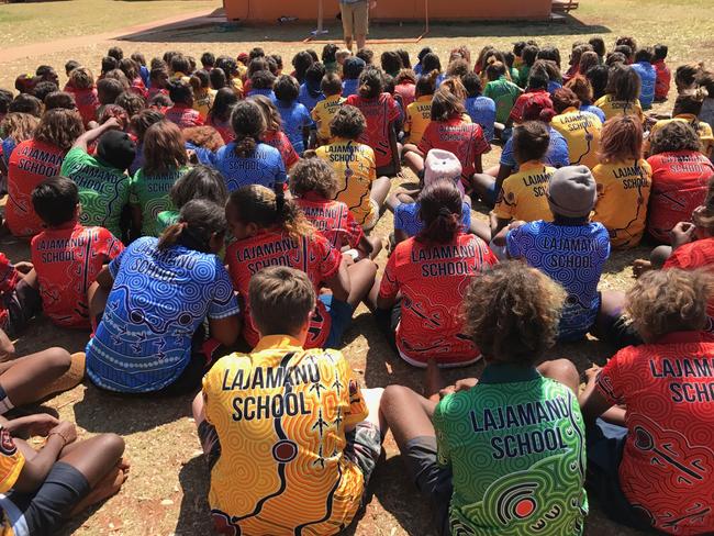 Lajamanu School students have brand new school uniforms that feature the four Warlpiri skin group colours, dreaming stories and animal totem designs. PICTURE: Supplied