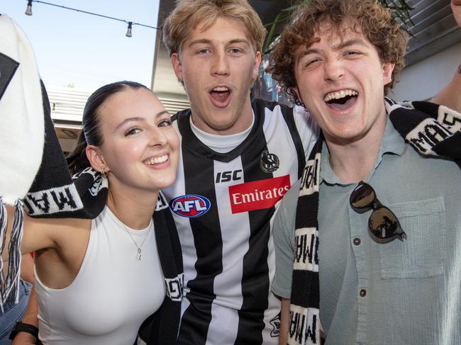 ADELAIDE, AUSTRALIA - Advertiser Photos SEPTEMBER 30, 2023: Imogen Schubert 21, Caleb Rhodes 22, and Haydn Dzenis 21 watching the AFL Grand Final Collingwood v Brisbane at The Highway on Anzac Parade  SA. Picture: Emma Brasier