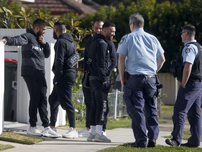 Raptor Squad officers talking with a group of men outside a home linked to the Alameddines following the shooting of Bilal Hamze in May. Picture: News Corp