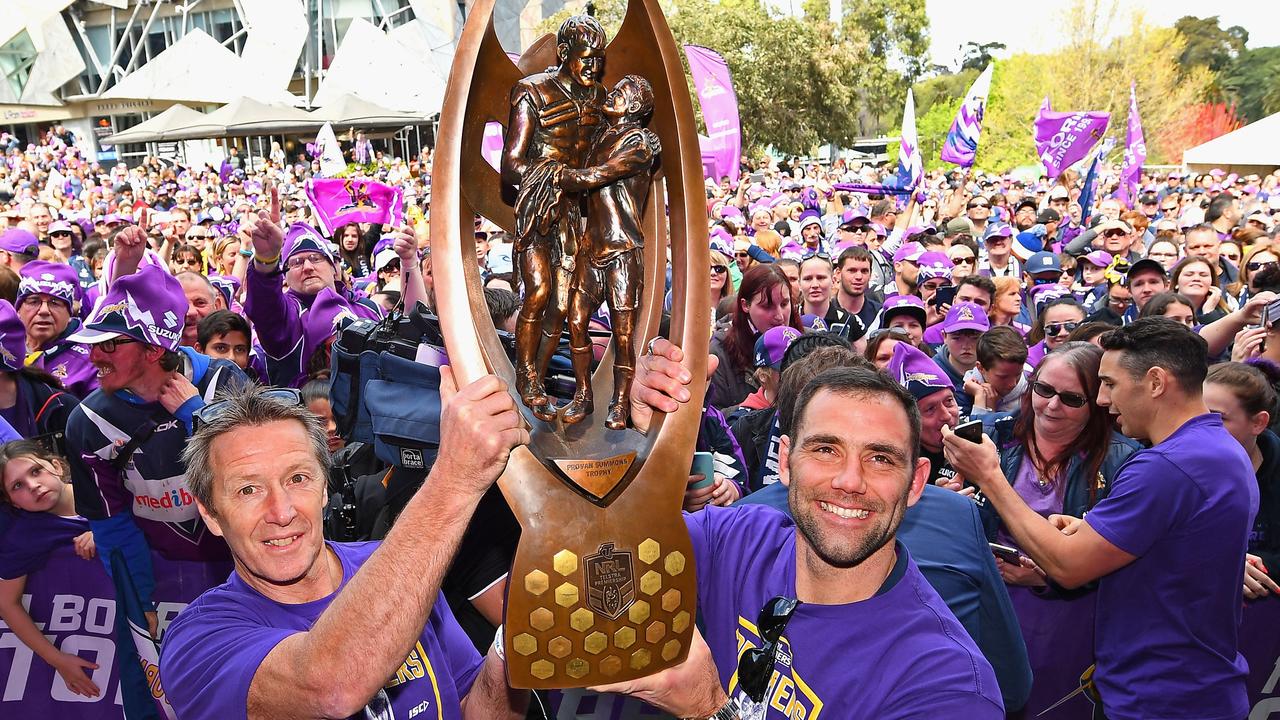 Cameron Smith and Craig Bellamy of the Storm hold up the NRL premiership trophy in 2017