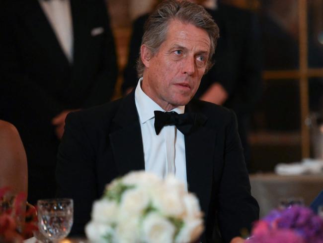 British actor Hugh Grant looks on during a dinner for King Charles. Picture: AFP