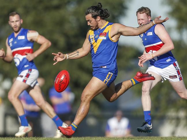 Nick Russo takes a kick for Cranbourne against Wandin last month. Picture: Valeriu Campan