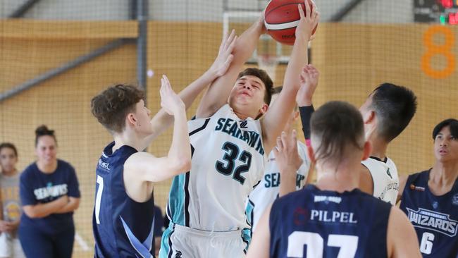 Basketball Queensland Under-16 Boys State Championships at the Coomera Indoor Sports Centre.Northside Wizards v North Gold Coast Seahawks. Seahawk Cody Sidebottom swamped by Wizard defence. Picture Glenn Hampson