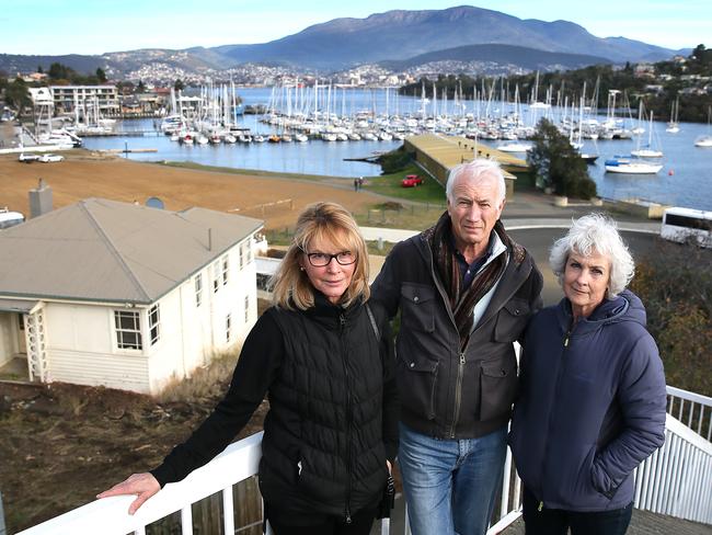 Bellerive residents Cheryl Davison, left, and Michael and Anne Geard in front of the Kangaroo Bay development site. Picture: SAM ROSEWARNE