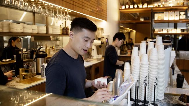 SYDNEY, AUSTRALIA - NewsWire Photos JULY 1, 2022: Workers at Regiment Cafe CBD on Friday. Picture: NCA NewsWire / Nikki Short