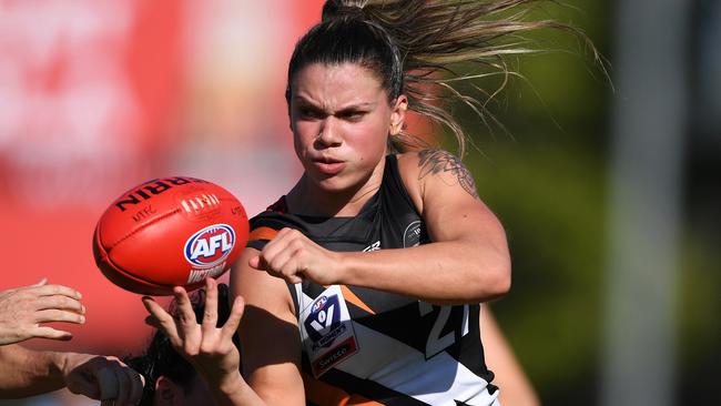 Anne Hatchard of NT Thunder gets a handball away in yesterday’s VFLW win over Carlton. Picture: Felicity Elliott/AFLNT Media.