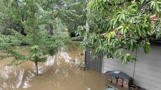 Adrian De'Athe's Camden property has been flooded, completely inundating the property. Picture: Annie Lewis