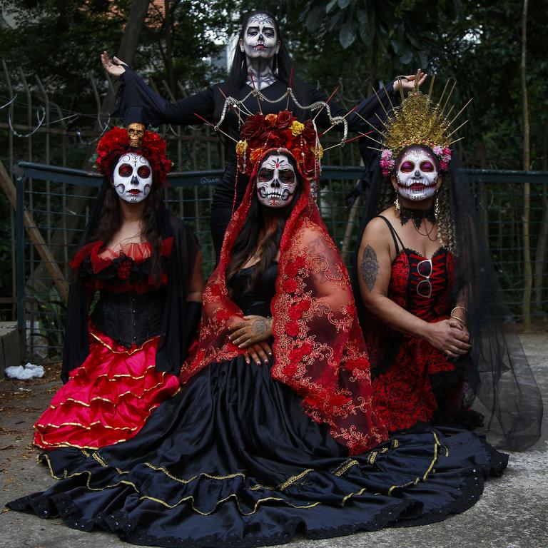 Women dressed as Catrinas take part in the Sao Paulo Zombie Walk in Brazil as part of Day of the Dead celebrations. Picture: Miguel Schincariol/AFP