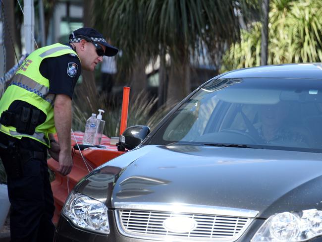 GOLD COAST, AUSTRALIA - NewsWire Photos OCTOBER 12, 2020: Police check cars at the Queensland border with NSW at Griffith Street in Coolangatta. Picture: NCA NewsWire / Steve Holland