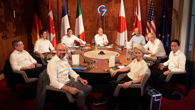 Fit as fiddles: (L-R) Italy's Prime Minister Mario Draghi, Canada's Prime Minister Justin Trudeau, European Council President Charles Michel, French President Emmanuel Macron, Germany's Chancellor Olaf Scholz, European Commission President Ursula von der Leyen, US President Joe Biden, Britain's Prime Minister Boris Johnson and Japan's Prime Minister Fumio Kishida attend a working dinner during the G7 Summit held at Elmau Castle, southern Germany.