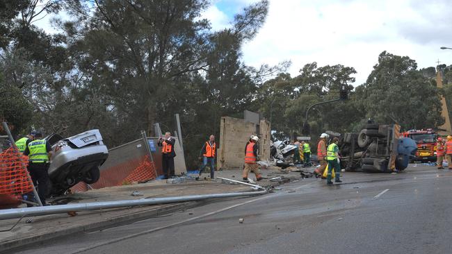 Emergency service workers at the crash scene. Picture: Roger Wyman