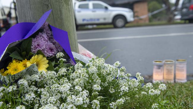 Flower tributes near the Labor Park home where it is alleged a father barricaded seven children and his partner inside a burning home. Picture: Jeremy Piper