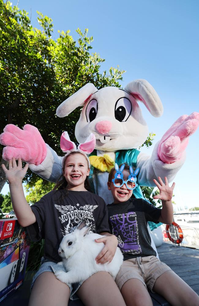 Getting ready for the Easter Eggstravaganza at Sanctuary Cove are siblings Elodie Barnard 6 and Lincoln Barnard 3, together with Pickles the bunny and EB the Easter bunny. Picture Glenn Hampson