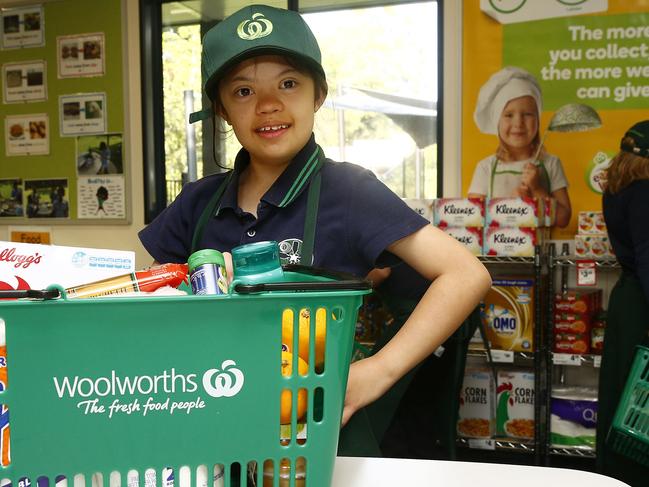 Student Shari-Anne Pearson, 12, with a basket of groceries from the mini-supermarket. Picture: John Appleyard