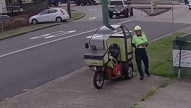 The postie retrieves the post from the back of their bike before sitting back down. Picture: Facebook.