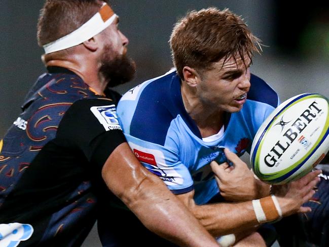 William Harrison of the Waratahs drops the ball as he is tackled during the Round 6 Super Rugby match between the NSW Waratahs and the Waikato Chiefs at WIN Stadium in Wollongong, Friday, March 6, 2020. (AAP Image/Mark Nolan) NO ARCHIVING, EDITORIAL USE ONLY