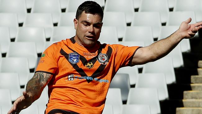 Bryce Hoskin kicks the Tigers out of trouble. Picture: John Appleyard