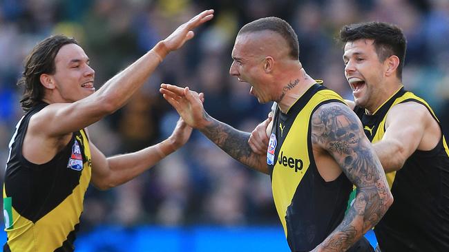 Daniel Rioli and Dustin Martin celebrate.