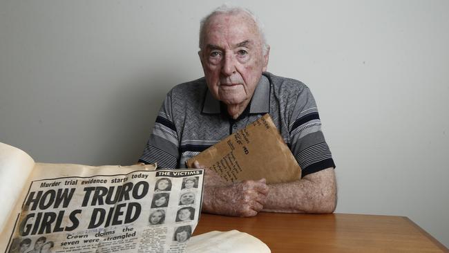 Retired Major Crime detective Ken Thorsen with old newspaper clippings at his home. Picture: Tait Schmaal