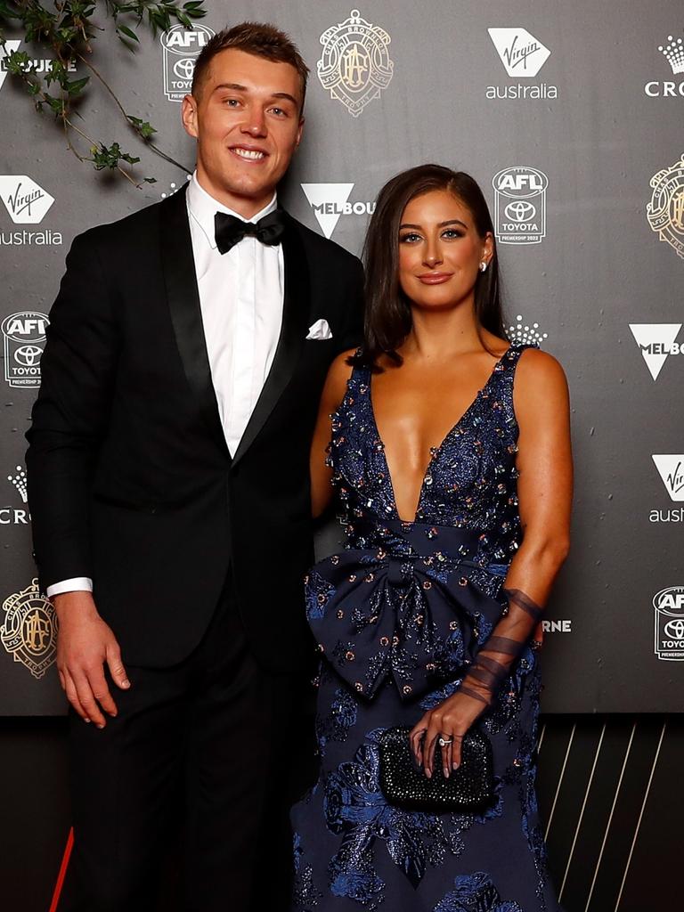 Patrick Cripps and Monique Fontana arrive.