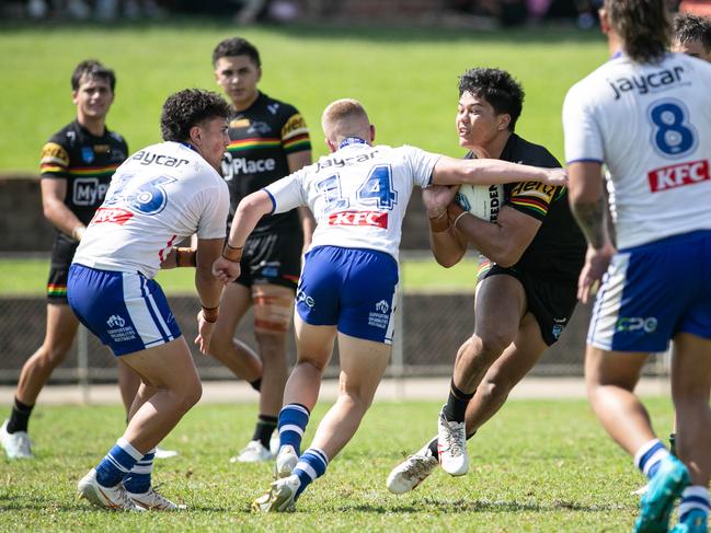 Talmage Brown is tackled by Tristan Burns. Picture: Julian Andrews