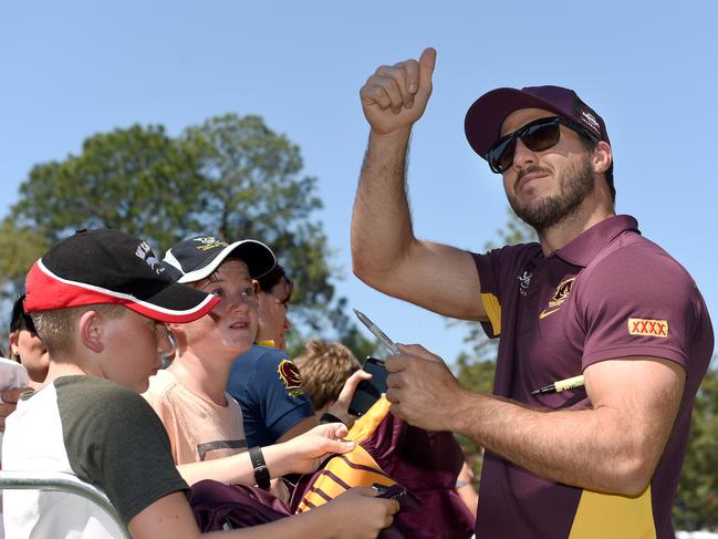 Ben Hunt is signs autographs for fans the day after the grand final defeat. Picture: Dave Hunt