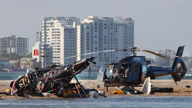 The devastating scene of a Helicopter crash between two SeaWorld Helicopters just outside the tourist park on a sandbank in the Southport Broadwater. Picture Glenn Hampson