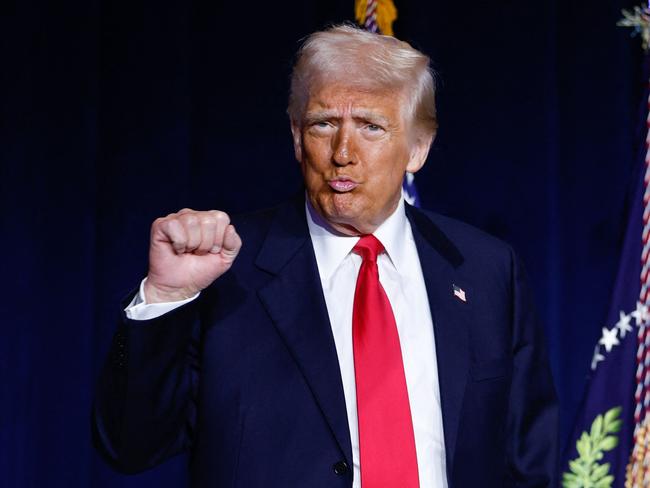 TOPSHOT - US President Donald Trump gestures as he arrives to speak during the National Prayer Breakfast at the Washington Hilton in Washington, DC, on February 6, 2025. (Photo by Ting Shen / AFP)