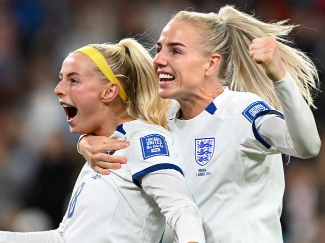 BRISBANE, AUSTRALIA - AUGUST 07: Chloe Kelly (L) of England celebrates with teammate Alex Greenwood (R) after scoring her team's fifth and winning penalty in the penalty shoot out  during the FIFA Women's World Cup Australia & New Zealand 2023 Round of 16 match between England and Nigeria at Brisbane Stadium on August 07, 2023 in Brisbane / Meaanjin, Australia. (Photo by Bradley Kanaris/Getty Images)