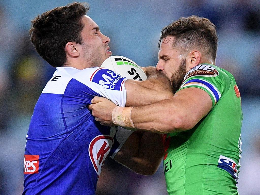 Nicholas Meaney of the Bulldogs is tackled by Aiden Sezer of the Raiders during the Round 12 NRL match between the Canterbury Bankstown Bulldogs and the Canberra Raiders at ANZ Stadium in Sydney, Saturday, June 1, 2019. (AAP Image/Dan Himbrechts) NO ARCHIVING, EDITORIAL USE ONLY