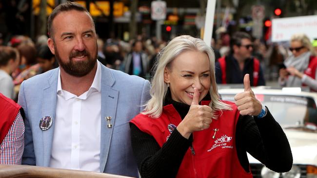 Single Gaze’s trainer Nick Olive and jockey Kathy O'Hara are all smiles during yesterday’s Melbourne Cup parade. Photo: Stuart McEvoy