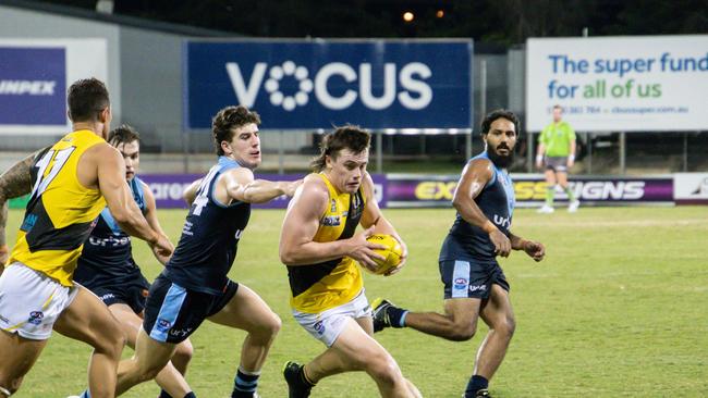 Nightcliff recruit Dominic Brew bursts through the pack. Picture: Celina Whan /AFLNT Media