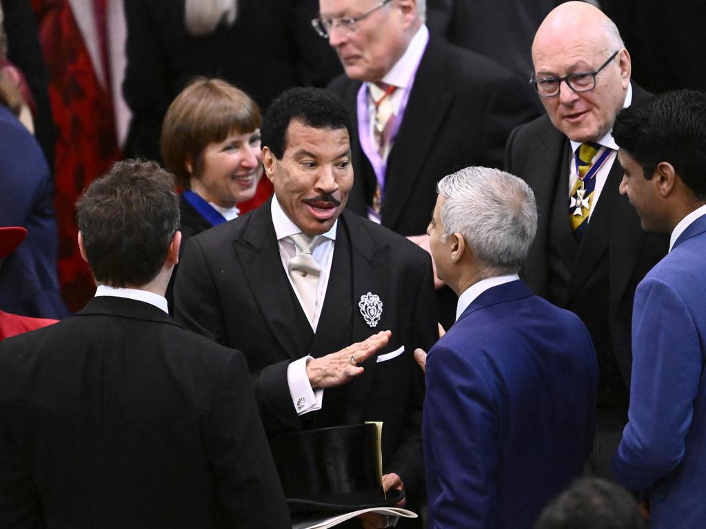 Lionel Richie chats with Mayor of London Sadiq Khan as he arrives at Westminster Abbey. Picture: Gareth Cattermole/Getty Images