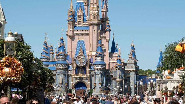 (FILES) In this file photo taken on September 30, 2022, visitors walk along Main Street at The Magic Kingdom at Walt Disney World in Orlando, Florida. - Disney on April 26, 2023, filed suit in federal court against Florida Governor Ron DeSantis and other members of his administration, alleging "a targeted campaign of government retaliation." The move is the latest salvo in an increasingly bitter fight between the entertainment giant and DeSantis, a Republican presidential hopeful for the 2024 election, over administrative control of the company's Florida theme parks. (Photo by Bryan R. Smith / AFP)