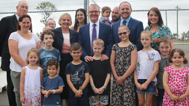 Annemarie Christie and Michael Daley (centre) with families at the Rouse Hill Hospital announcement.