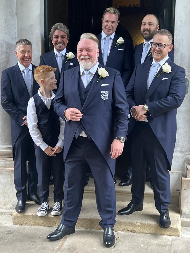 The groom and his men pose in front of the Darling Point mansion where the ceremony and reception took place.