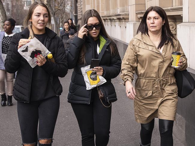 Roberta Williams (right) is seen with daughter Dhakota (centre) and friend arriving at the Melbourne Supreme Court. Picture: AAP