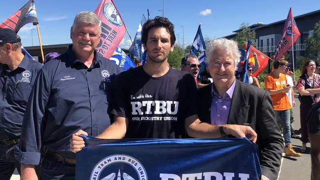 Union members protest outside the Rouse Hill Tallawong Sydney Metro station. From left to right: Alex Claassens, Robert (employee who was sacked) and Adam Searle.