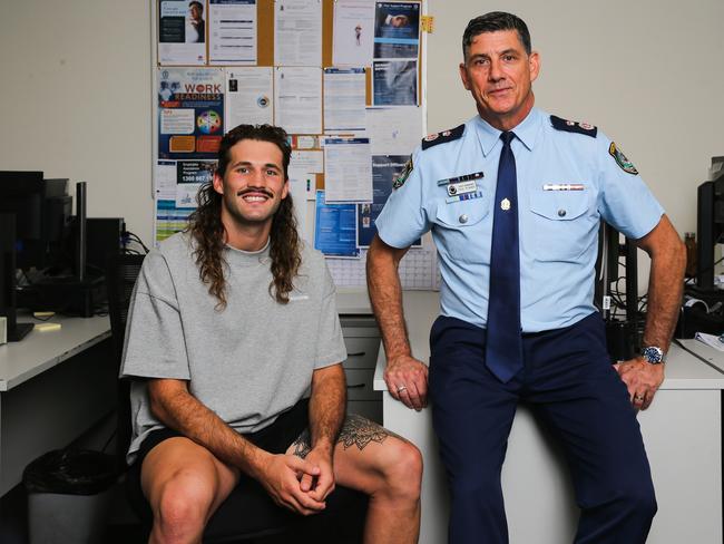 Footy star Josh Curran with Deputy Commissioner Paul Pisanos working on a plan of attack to steer kids away from crime. Picture: Gaye Gerard