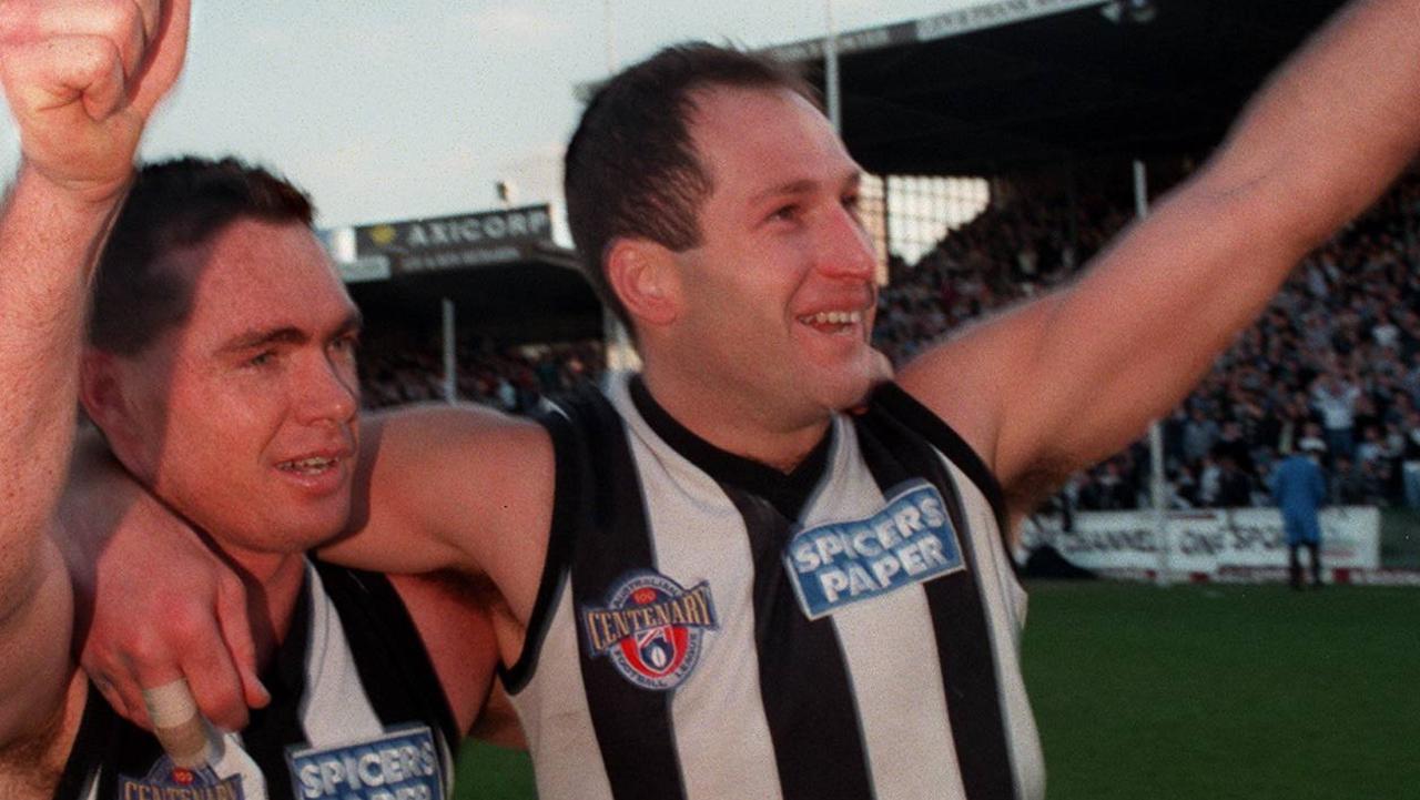 New Collingwood chief executive Craig Kelly (right) and Alan Richardson farewell the Victoria Park faithful following their last game for the club in 1996.