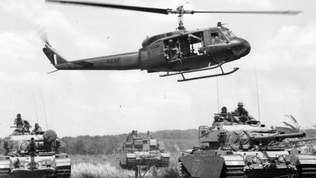 Australian Army armoured operations in Vietnam. An RAAF Iroquois Helicopter of No. 9 Squadron hovers over an Australian Army Centurion tank patrol in South Vietnam. The helicopters are partners in the Australian Task Force with the newly arrived Centurions, both in action in Operation Pinnaroo in Phuoc Tuy Province in 1968.