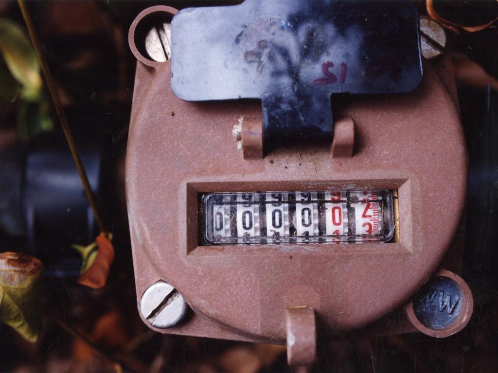 Water meter reader on the vacant property of Alan Bennett, 1990s.