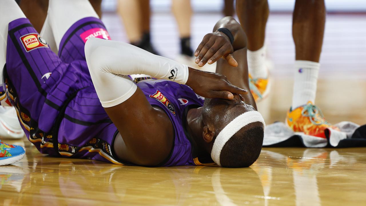 Kings' Kouat Noi lies on the court after being floored by Taipans' DJ Hogg in the NBL semi final match between the Cairns Taipans and the Sydney Kings, held at the Cairns Convention Centre. Photo: Brendan Radke