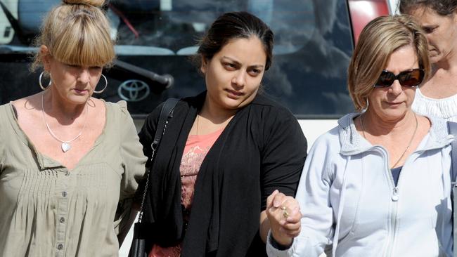 Sofina Nikat (centre), whose 15-month-old daughter Sanaya Shaib was found murdered on Sunday, is led away from her home in West Heidelberg by two social workers. Picture: Andrew Henshaw